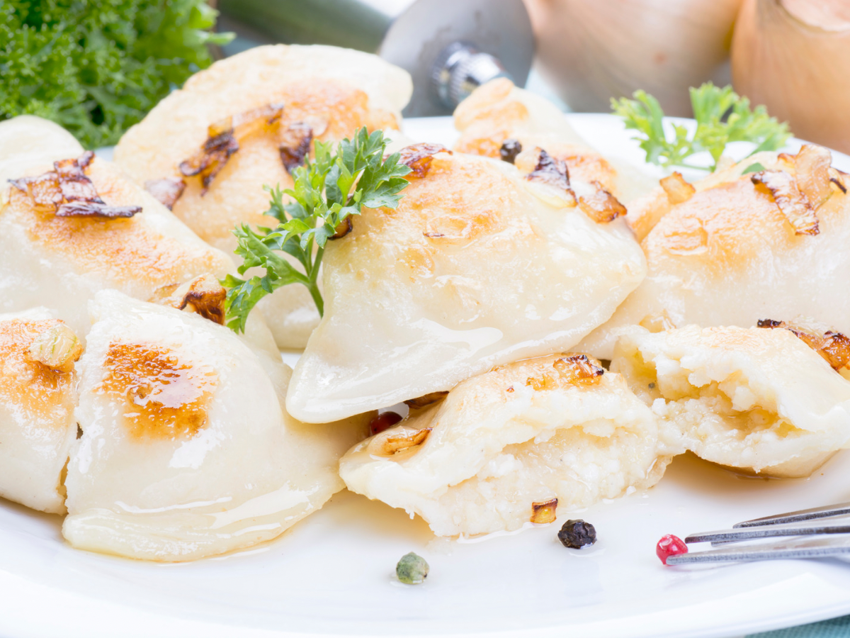 Warm Up This Winter: 10 Hearty Polish Recipes to Try in 2023 3 Polish pierogi on a plate.